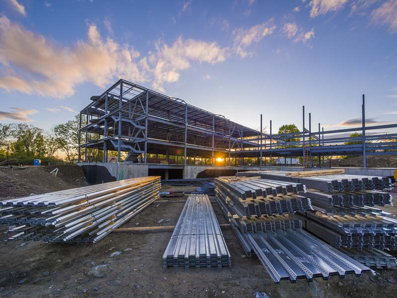 A pile of steel materials on the ground ready to be installed